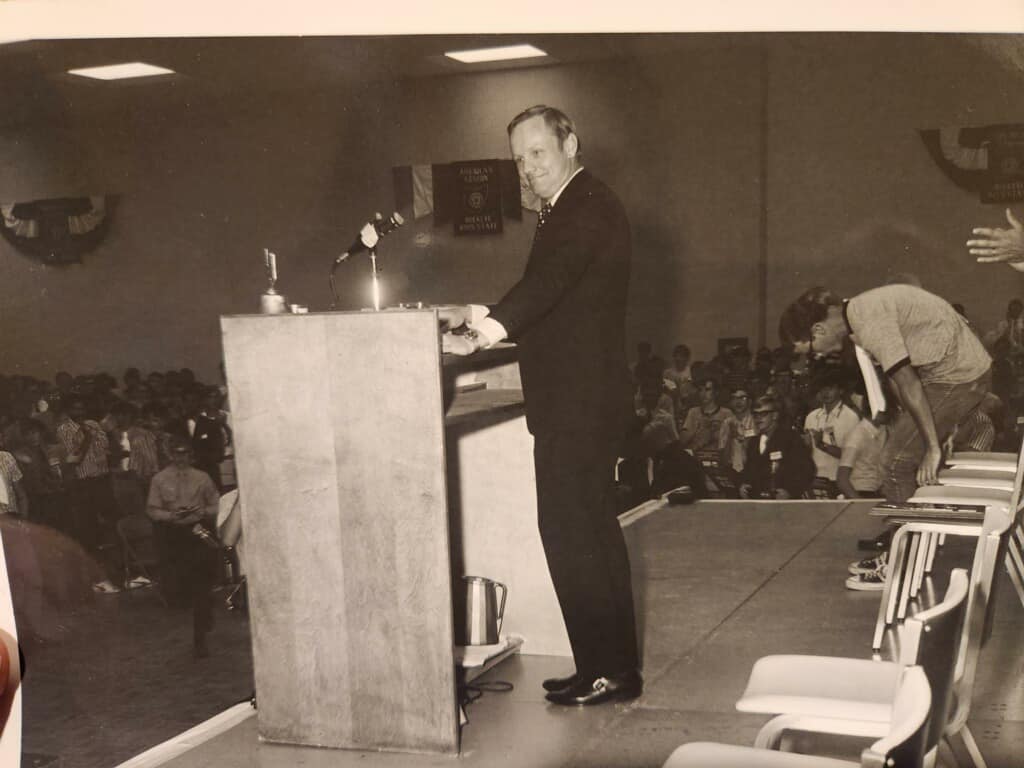 Man accepting award on stage